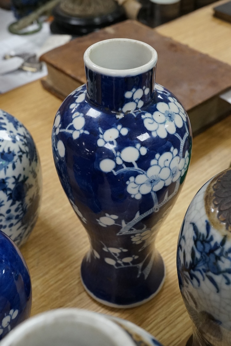 Chinese blue and white porcelain, late 19th century, comprising two prunus vases, two crackle glaze vases and a 'Bird and Flowers' jar, tallest crackle glaze vases 23cm